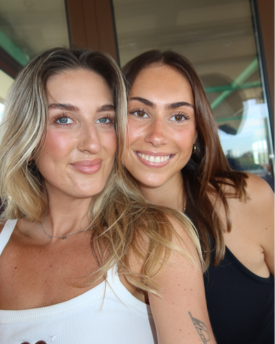 Close-up selfie of two smiling people